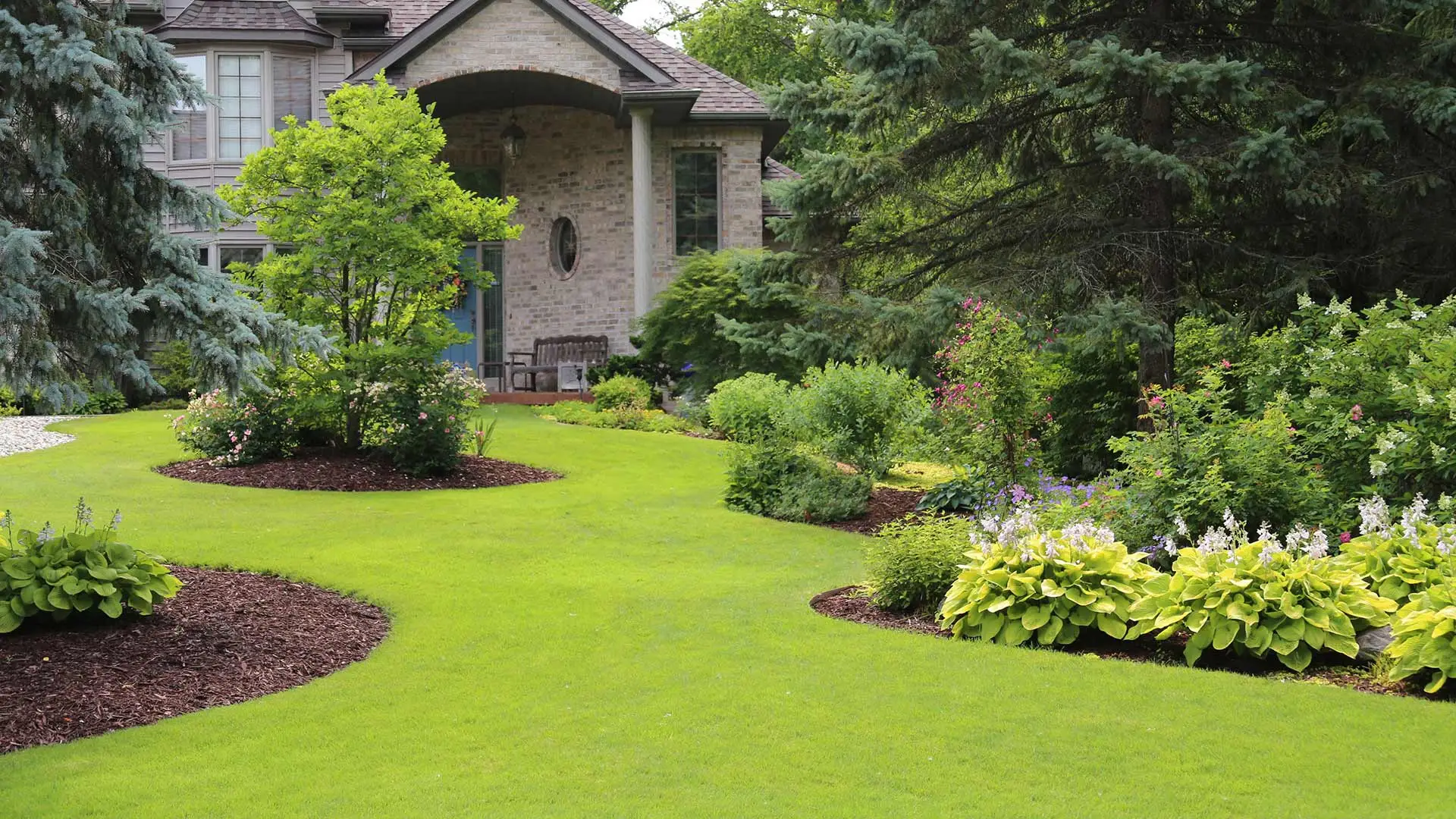 Lawn with regular lawn care services near East Lansing, MI.