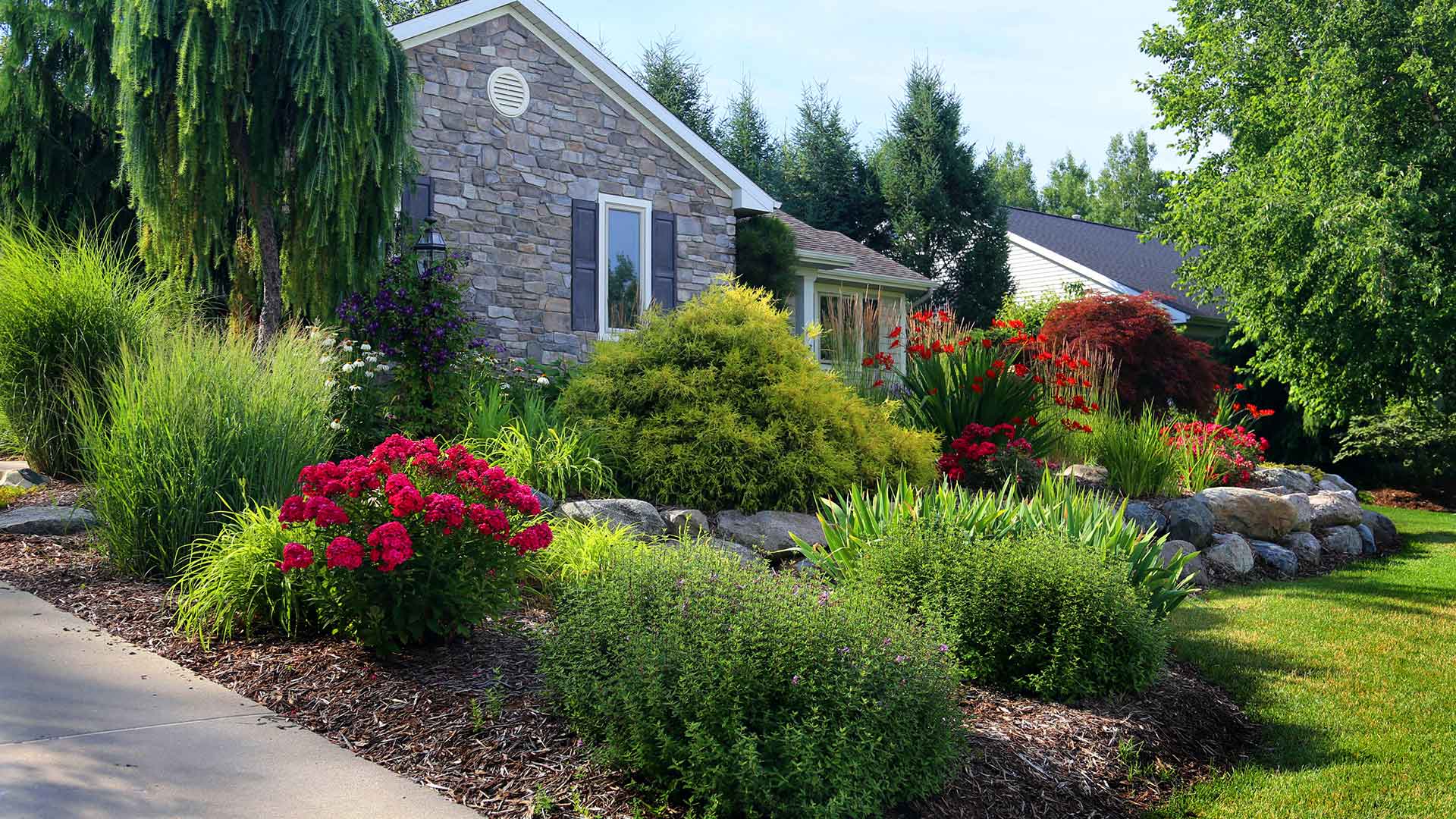 Lush landscaping installed around a home in East Lansing, Michigan.