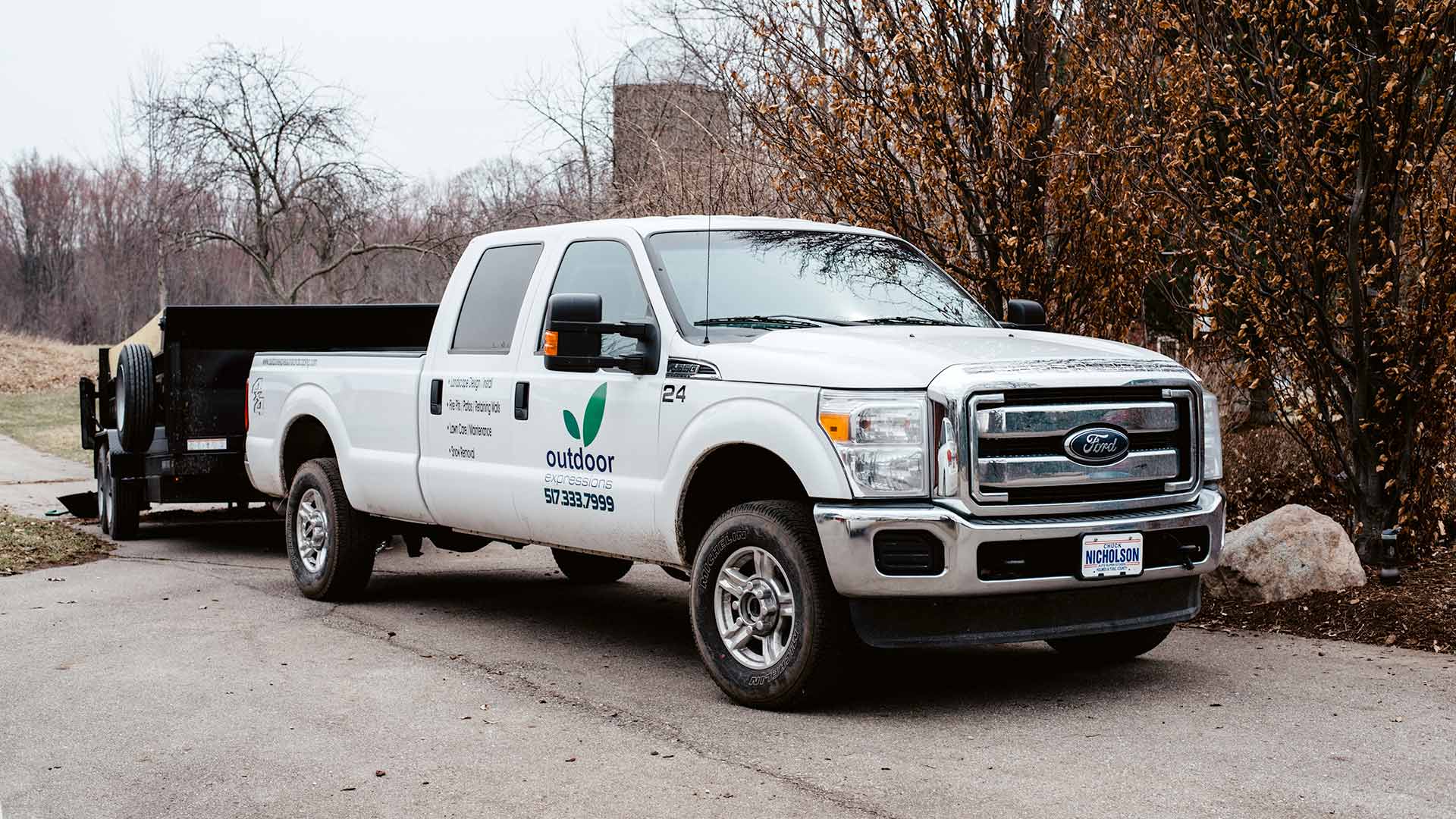 Outdoor Expressions Landscaping work truck.