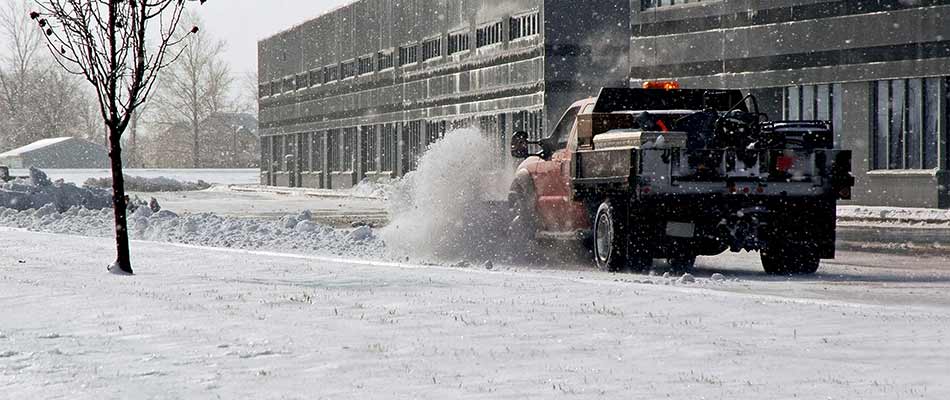 Commercial snow plowing services in Lansing, Michigan.