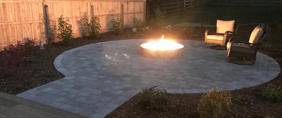 Fire pit installed over patio in Lansing, MI.