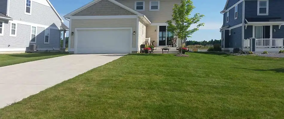 Lawn with mowing services near Haslett, MI.